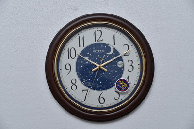 Amms Wall Clock, Dial is glowing in night, Galaxy visible in night